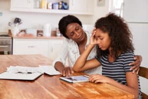 concerned parent talking to teen about the benefits of an intervention